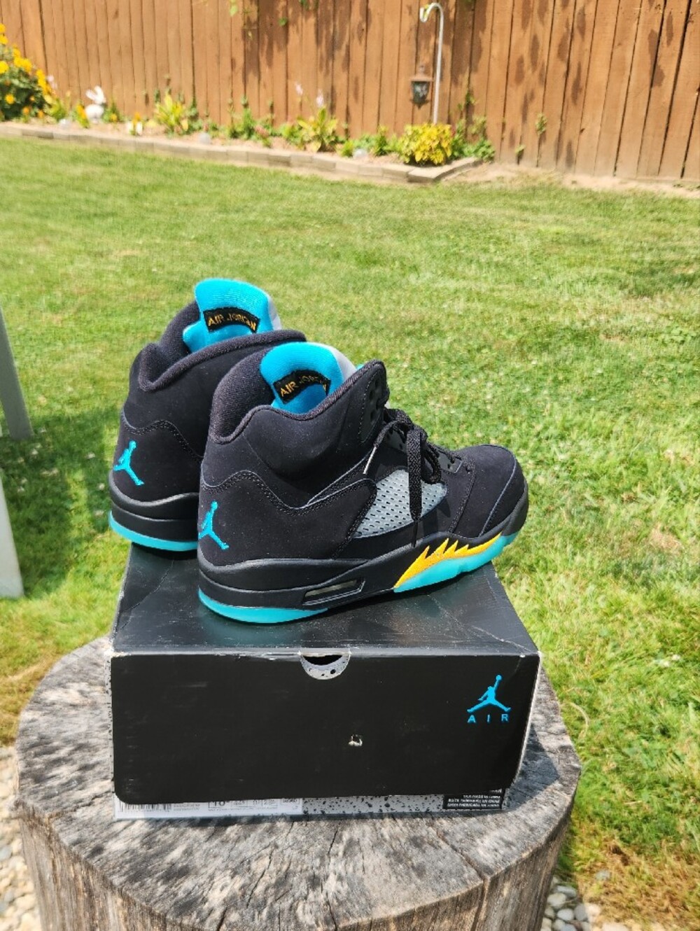 Jordan Retro 5 Sneakers in Black with Teal and Yellow Accents - Picture 2 of 6